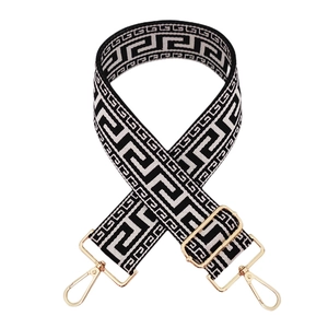 Adjustable wide replacement bag strap with black and white Greek key pattern and gold hardware