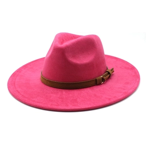 Detail of fuchsia wide brim fedora hat with brown suede band and golden metal buckle