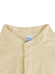 Detail of mandarin collar and buttoned placket on beige striped polo shirt for men