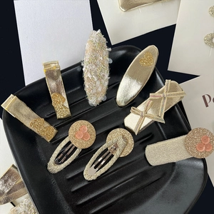 8-piece set of elegant gold sequin bows and tweed hair clips for women