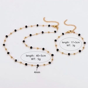 Ensemble bijoux acier inoxydable doré avec perles noires et détails de taille