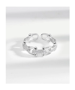Macro detail of silver 925 sterling chain ring with cubic zirconia micro-inlay