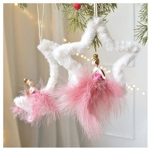 Detail of pink feather ballerina hanging ornament with white star frame for Christmas tree