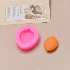 Detailed pink silicone strawberry mold with textured fruit resin craft project