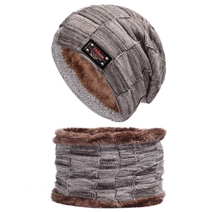 Close-up of thick checkered knit beanie and neck warmer with warm brown fleece lining