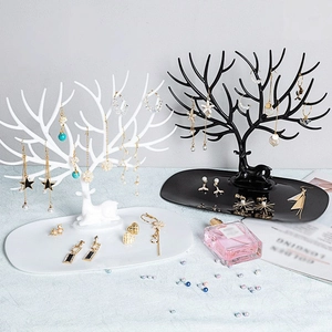 Detail view of black and white deer antler jewelry organizers with stable base trays