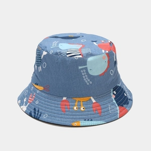 Detail of blue sun hat showing vivid marine animal patterns and durable twill fabric