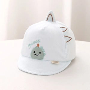 Close-up of light blue baby hat with dinosaur embroidery and textured ribbed cotton fabric