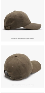 Detail of tan cotton baseball cap featuring embroidered eyelets and adjustable metal buckle