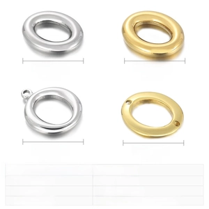 Macro view of stainless steel hollow oval jewelry charms in silver and gold finishes