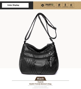 Detail view of black washed PU leather crossbody bag with multiple zipper pockets