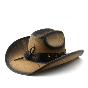 Detailed close-up of woven cowboy straw hat with faux leather studded band and cow skull accent