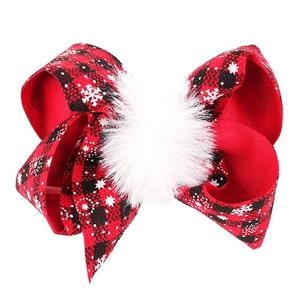 Christmas 4 inch red flannel hair bow with white snowflake prints and a plush pompom