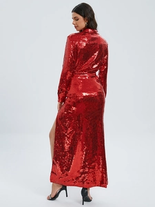 Detailed side view of a shimmering red sequined maxi dress with a sexy high side slit