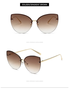Detail view of cat eye sunglasses with golden metal frame and gradient brown lenses