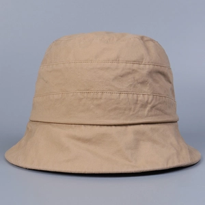 Detail of breathable khaki washed cotton bucket hat with textured fabric and clean finish