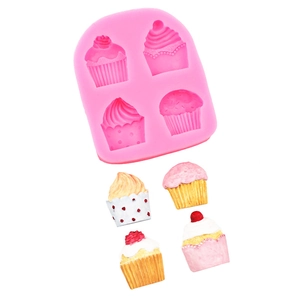 Pink silicone cupcake mold with four cavities and realistic finished fondant decorations