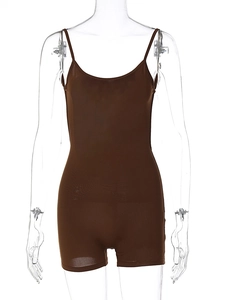 Detailed close-up of dark brown ribbed bodysuit with slim straps and bodycon fit