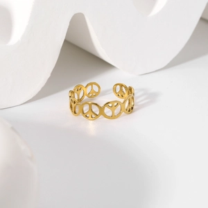 Detail of adjustable gold-plated stainless steel ring with hollow peace sign pattern