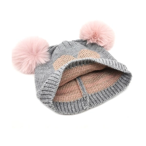Kids winter knit hat with double pink pom-poms and gray heart pattern for cold weather