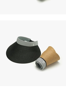 Detailed view of foldable straw sun visors in black and khaki with houndstooth trim