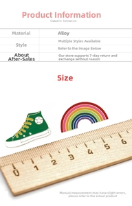 Detailed size measurement of enamel rainbow and high-top shoe lapel pins on wooden ruler