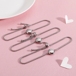 Detailed view of adjustable silver zodiac bracelets with Libra, Scorpio and Sagittarius charms