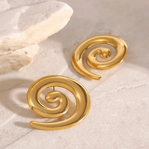 Minimalist 18k gold plated stainless steel spiral stud earrings on stone texture
