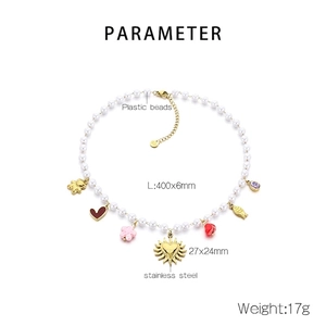 Detail view of colorful dopamine style beaded necklace with heart and fish charms