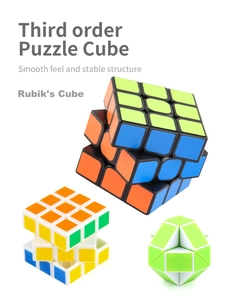 Detail of 3x3 speed cube with white and black bases and green twist puzzle toy