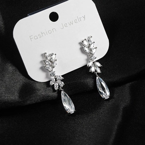Detail of S925 silver needle drop earrings with marquise and pear cut zircon crystals