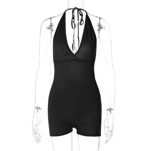 Detail of black halter neck bodysuit showing deep V-neckline and elastic ruched fabric