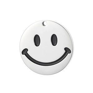 Detailed close-up of a round stainless steel smiley face pendant with smooth metal finish