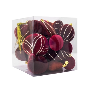 Set of burgundy velvet Christmas balls in various shapes with gold accents in a clear gift box