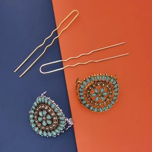 Detail view of turquoise flower hairpins and clips in vintage gold and silver metal