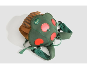 Detail view of colorful kids backpack featuring mesh shoulder straps and premium stitching