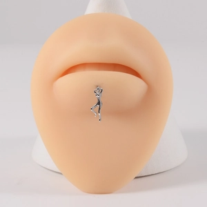 Detailed view of silver stainless steel dancer lip ring on a realistic lip model