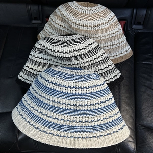 Close-up of color-block striped crochet pattern on breathable knit bucket hats