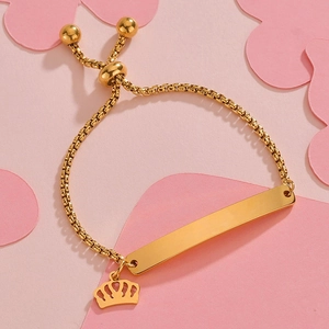 Adjustable gold bead chain bracelet with engravable rectangular bar and crown charm