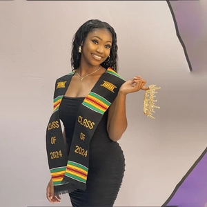 Class of 2024 black graduation stole with kente-style stripes and gold crown