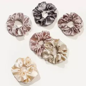 Detailed view of 6-piece satin scrunchie set in assorted metallic pastel colors