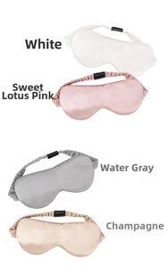 Stack of 22 momme mulberry silk sleep masks in white, pink, grey, and champagne colors