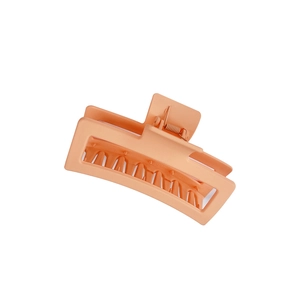 Matte orange 13cm large square shark hair clip with interlocking teeth on white background