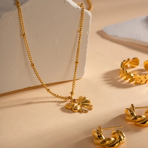 Elegant 18K gold-plated stainless steel jewelry set with butterfly necklace and ring