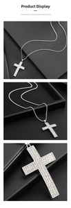 Detailed close-up of a silver cross pendant necklace with sparkling pavé cubic zirconia