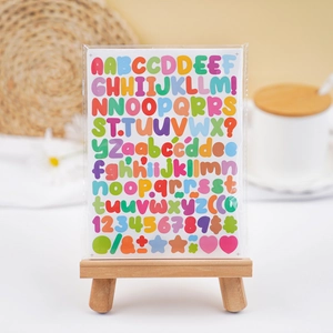 Colorful 0.5 inch alphabet and number stickers set displayed on a mini wooden easel