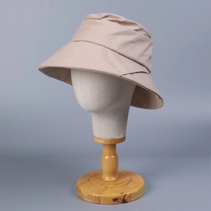 Women's wide brim cotton linen sun hat in beige with natural pleated texture and chic design