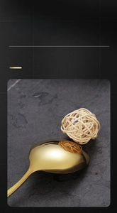 Macro shot of gold stainless steel spoon showing high-gloss mirror polished finish
