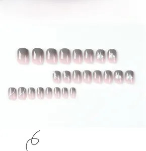 Detail view of 24pcs short square press-on nails with grey pink gradient and silver stars