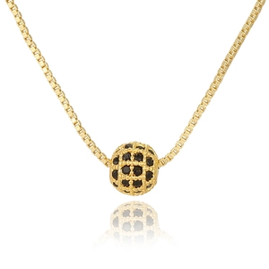 Close-up of golden box chain with a hollow grid ball pendant featuring black gemstones